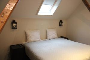 Postel nebo postele na pokoji v ubytování Hotel B&B Hoeve de Vredenhof