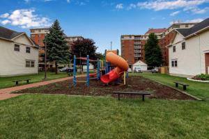 a playground with a slide in a park at Modern Trendy Downtown in Buffalo