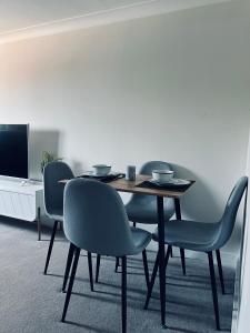 a dining room with a table and chairs at Deluxe 2 Bedroom Apartment in Sheffield