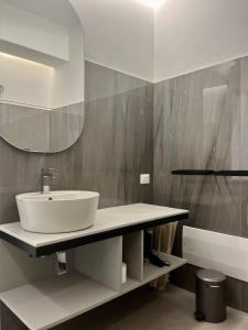 a bathroom with a sink and a mirror at Il Volo in Sperlonga +76 photos