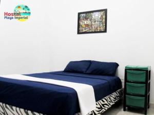 Cama o camas de una habitación en Hostal Playa Imperial Manta