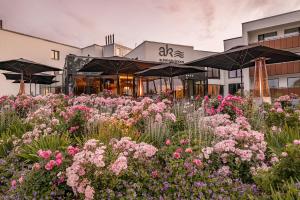 a field of flowers in front of a building at Auksinės Kopos in Šventoji