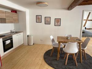 a kitchen and dining room with a table and chairs at GetAway in Eberbach im Odenwald nahe Heidelberg in Eberbach