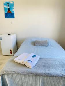 A bed or beds in a room at Hanuá Beach House