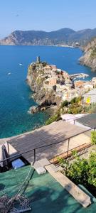 a view of a small town on a rocky island at Da Pietro e Sandra in La Spezia