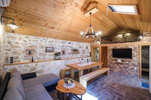 a living room with a couch and a table at Holiday house Manuela in Kruševo