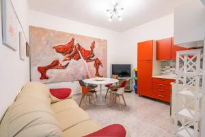 a living room with a couch and a table at Casa Vacanze Relaxia in Posada +10 photos