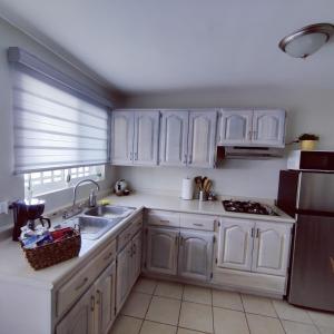 Kuchyň nebo kuchyňský kout v ubytování Divino depa remodelado, tranquilo y centrico.