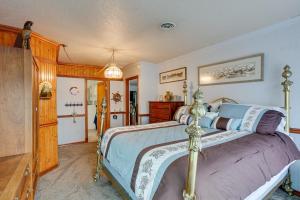 a bedroom with a large bed in a room at Tacoma Home on Steilacoom Lake with Dock! in Tacoma