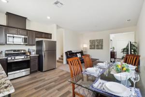 a kitchen and living room with a table and chairs at Carson City Retreat about 1 Mi to Hot Springs! in Carson City