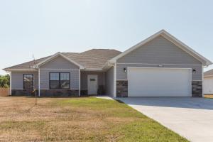 a house with a gray house with a white garage at Charming St Robert Home Near Downtown Waynesville! in Waynesville