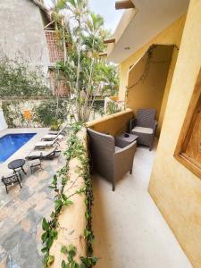 an outdoor patio with chairs and a swimming pool at Casa Di Giulio in San Francisco