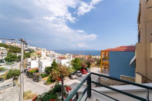a view of a city street from a balcony at Stay in calm in Kavála