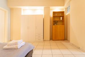 a bedroom with a bed and a closet at Stay in calm in Kavála +35 photos