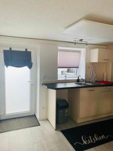 Kuchyň nebo kuchyňský kout v ubytování Practical Loft Comfort near Munich