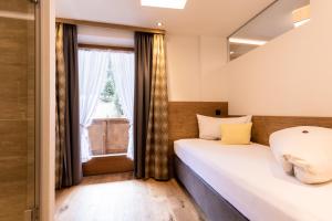 Postel nebo postele na pokoji v ubytování Hotel Schlosshof