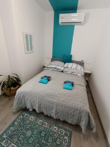 a bedroom with a bed with two pillows on it at Porta Danube in Budapest