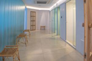 a corridor with chairs and tables in a room at Carilo Hills by bund in Carilo