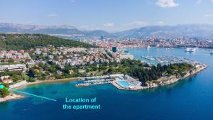 an aerial view of a city and a harbor at Beachfront apartment Milan, with balcony in Split