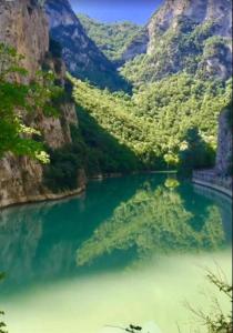 a view of a river in a mountain valley at Hotel La Ginestra in Acqualagna