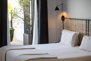 Łóżko lub łóżka w pokoju w obiekcie 7 Islas Hotel