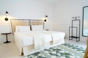 Łóżko lub łóżka w pokoju w obiekcie 7 Islas Hotel