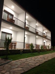 a white building with balconies on the side of it at Nirvana Boutique Hotel in Datca