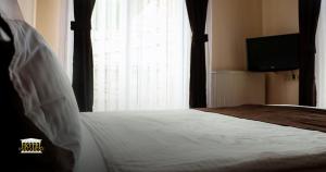 Postel nebo postele na pokoji v ubytování Hotel Parlament