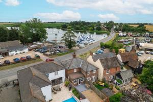an aerial view of a town with a river at Mill Dam Lake House in Saint Osyth