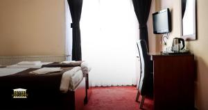 Postel nebo postele na pokoji v ubytování Hotel Parlament