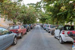 a row of cars parked on the side of a street at Luxury cozy appartment in the city center in Rhodes Town