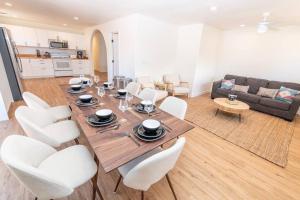 a dining room and living room with a table and chairs at Newly Remodeled Family Friendly Home in Page