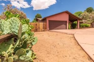a house with a cactus in front of a driveway at Newly Remodeled Family Friendly Home in Page
