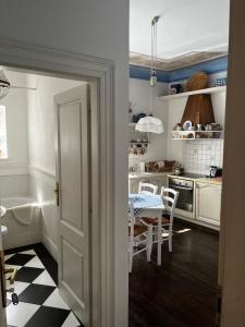 a kitchen with a table and a dining room at Apartment Hisa 7 Piran in Piran
