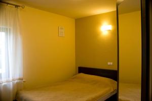 Postel nebo postele na pokoji v ubytování C&C Karo Resort