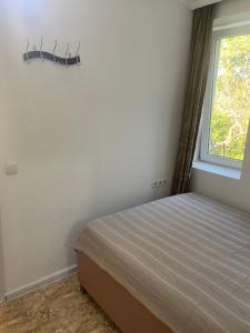 Postel nebo postele na pokoji v ubytování Maguli Home Gonio