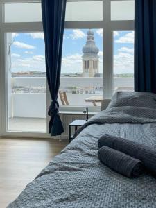 Ένα ή περισσότερα κρεβάτια σε δωμάτιο στο Cosy flat with stunning view