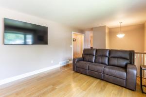 a living room with a couch and a television at CozyLiving in Billings