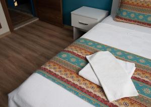 Postel nebo postele na pokoji v ubytování Mavi Yaprak Hotel