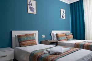 Postel nebo postele na pokoji v ubytování Mavi Yaprak Hotel