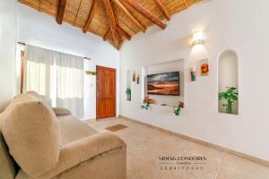 a living room with a couch and a window at Nido de cóndores in Purmamarca