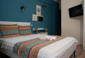 Postel nebo postele na pokoji v ubytování Mavi Yaprak Hotel