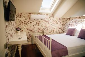 Filip Deluxe Rooms客房内的一张或多张床位