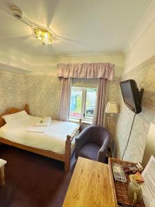 Postel nebo postele na pokoji v ubytování Herrislea House Hotel