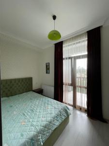 A bed or beds in a room at Green house - Apartment 1g - 17
