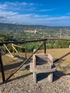 a bench sitting on top of a balcony with a view at Casa Mara - Diano Serreta in Diano Marina