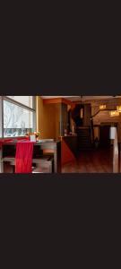 mit Blick auf eine Küche und ein Wohnzimmer in der Unterkunft Self CheckIn Hotel Heckenrose Lorin in Ringsheim