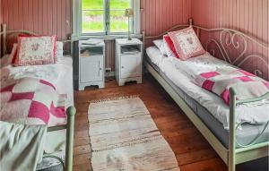 a room with two bunk beds and a window at Lovely Home In Lundamo With Kitchen 
