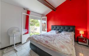 a red bedroom with a bed and a red wall at Stunning Home In Bassan With Wifi in Bassan