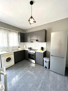 Kuchyň nebo kuchyňský kout v ubytování Atrium Apartment #3